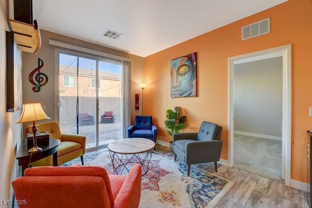 sitting room featuring light hardwood / wood-style flooring