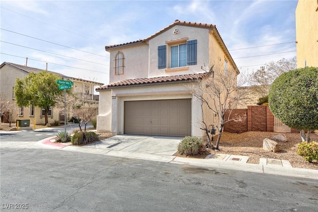 mediterranean / spanish-style home with a garage