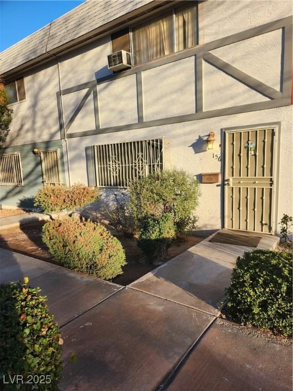 doorway to property featuring cooling unit