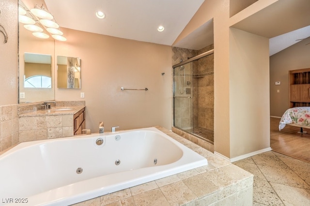 bathroom featuring vanity and shower with separate bathtub