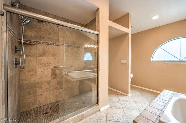 bathroom featuring separate shower and tub and sink