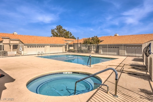 view of pool with a patio area and a community hot tub