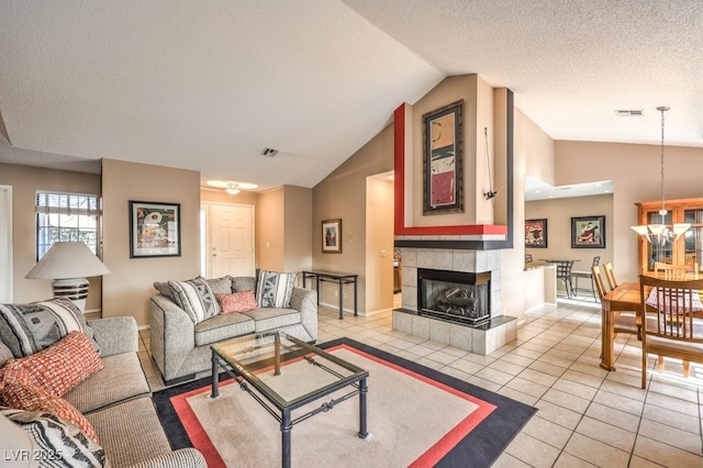 tiled living room with a fireplace, lofted ceiling, and a textured ceiling