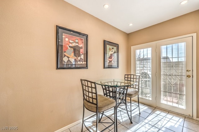 dining area featuring light tile patterned floors