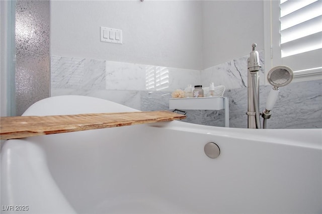 bathroom with a tub