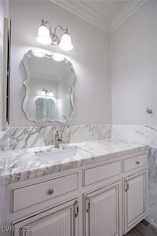 bathroom featuring ornamental molding and vanity