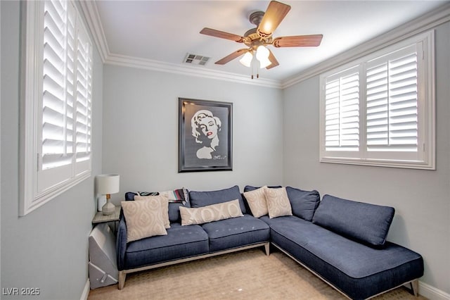 living room featuring ornamental molding and ceiling fan