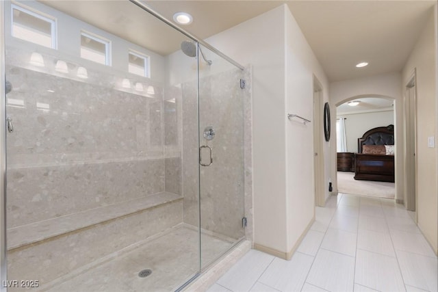 bathroom featuring tile patterned flooring and a shower with shower door