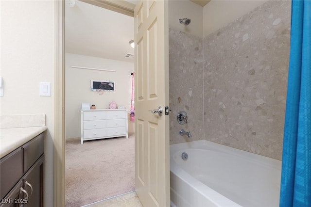 full bath with visible vents, vanity, and shower / bathing tub combination