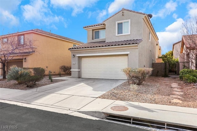 mediterranean / spanish-style home featuring a tiled roof, stucco siding, driveway, and a garage