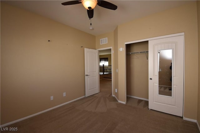 unfurnished bedroom featuring a ceiling fan, carpet flooring, baseboards, visible vents, and a closet