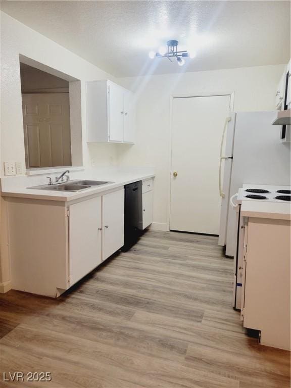 kitchen with black dishwasher, light countertops, white electric stove, and white cabinets