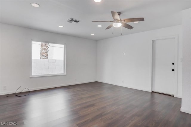 spare room with ceiling fan, recessed lighting, visible vents, baseboards, and dark wood finished floors