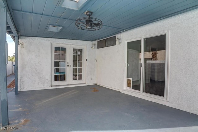 view of patio with ceiling fan and french doors