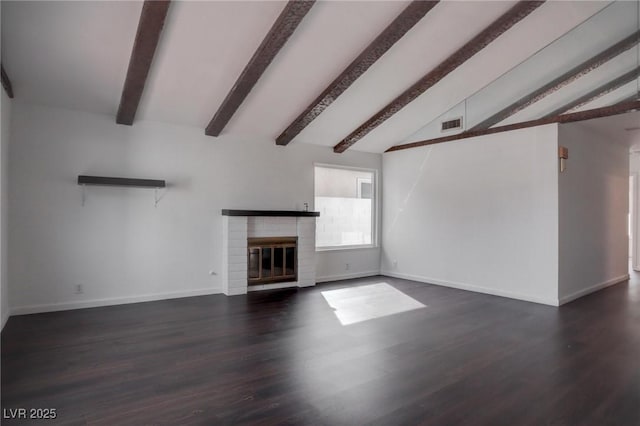 unfurnished living room featuring baseboards, visible vents, lofted ceiling with beams, dark wood-type flooring, and a brick fireplace