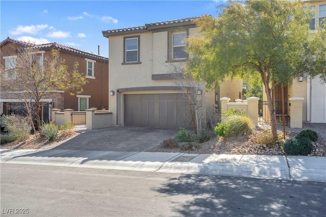 view of front of home featuring an attached garage, fence, decorative driveway, and stucco siding