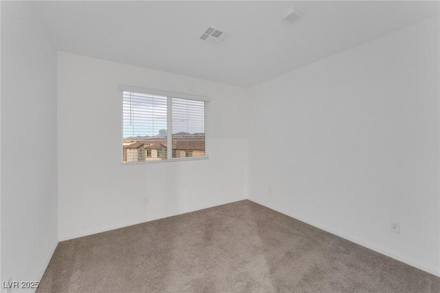 empty room with carpet and visible vents