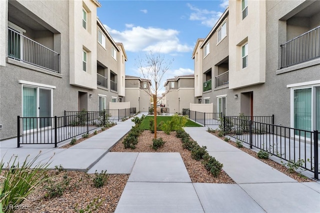 surrounding community featuring a residential view and fence