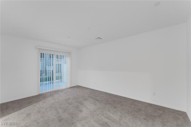 carpeted spare room with visible vents