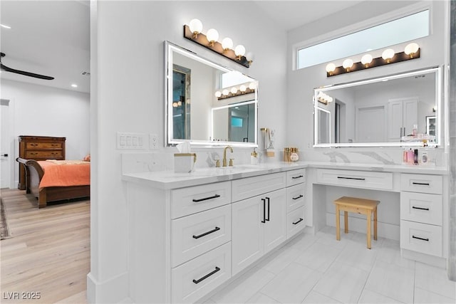 full bathroom with tasteful backsplash, ensuite bath, vanity, and a ceiling fan