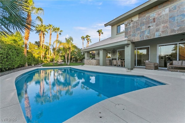 outdoor pool featuring a patio area