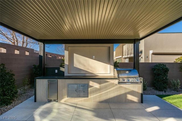 view of patio featuring a fenced backyard and area for grilling