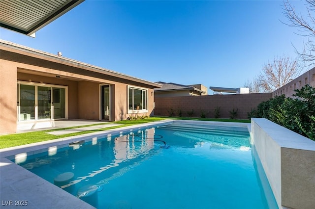 view of pool featuring a fenced in pool, a patio area, and a fenced backyard