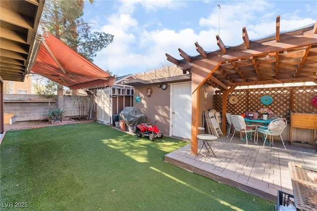 2245 Saint Paul Way, Las Vegas, NV 89104 - view of yard featuring a storage shed, a patio, an outbuilding, fence, and outdoor dining space