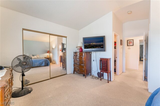 2245 Saint Paul Way, Las Vegas, NV 89104 - bedroom with lofted ceiling, a closet, and light colored carpet
