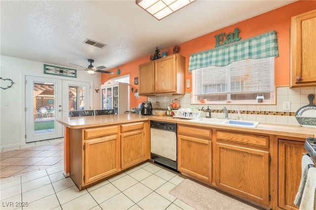 2245 Saint Paul Way, Las Vegas, NV 89104 - kitchen with dishwasher, light countertops, a peninsula, and a sink