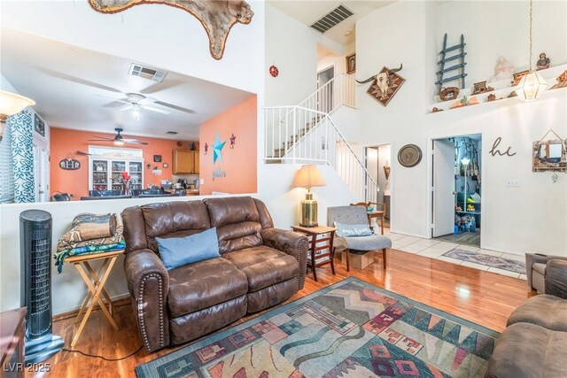2245 Saint Paul Way, Las Vegas, NV 89104 - living room featuring light wood-type flooring, visible vents, and stairway
