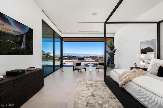 bedroom featuring access to exterior, light tile patterned floors, and floor to ceiling windows