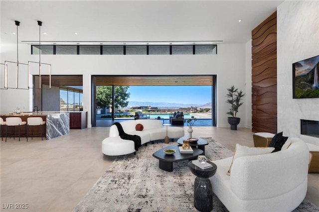 living room with recessed lighting and a premium fireplace