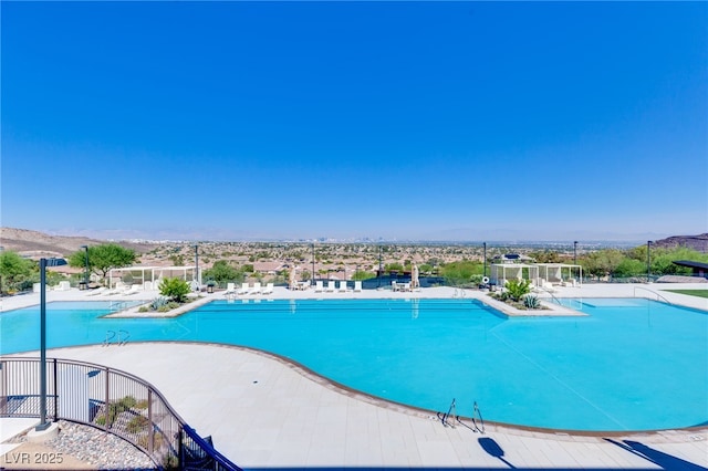 pool featuring a patio and fence