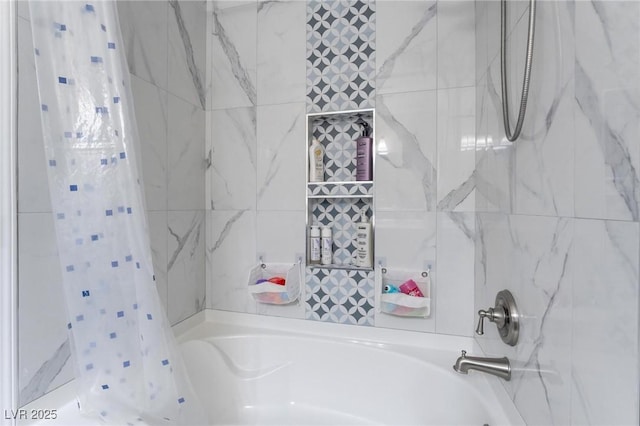 bathroom with shower / bath combo with shower curtain