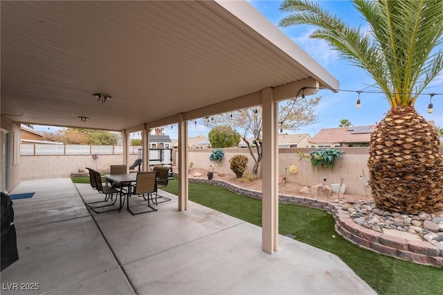 view of patio / terrace featuring outdoor dining space and a fenced backyard