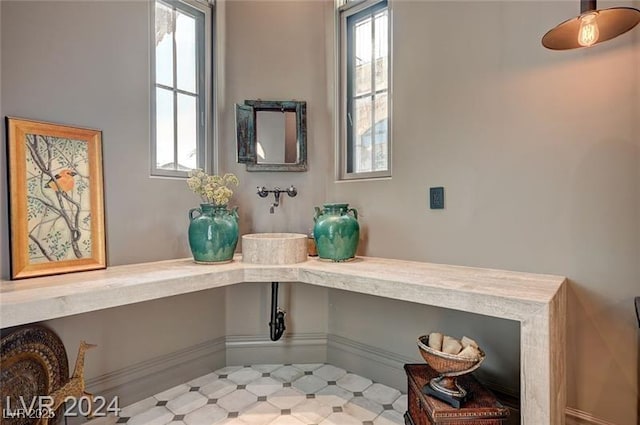 details featuring built in study area and tile patterned floors