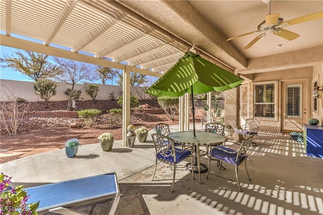 view of patio / terrace featuring outdoor dining area, a fenced backyard, ceiling fan, and a pergola