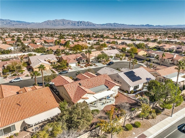 birds eye view of property with a residential view and a mountain view