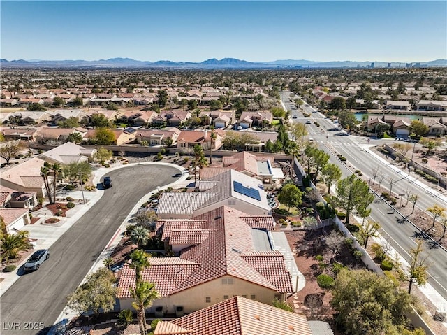 birds eye view of property featuring a mountain view and a residential view