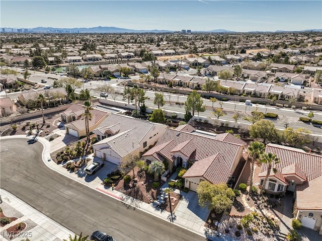 drone / aerial view with a residential view and a mountain view