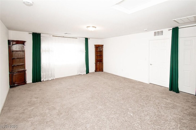 empty room with light carpet and visible vents