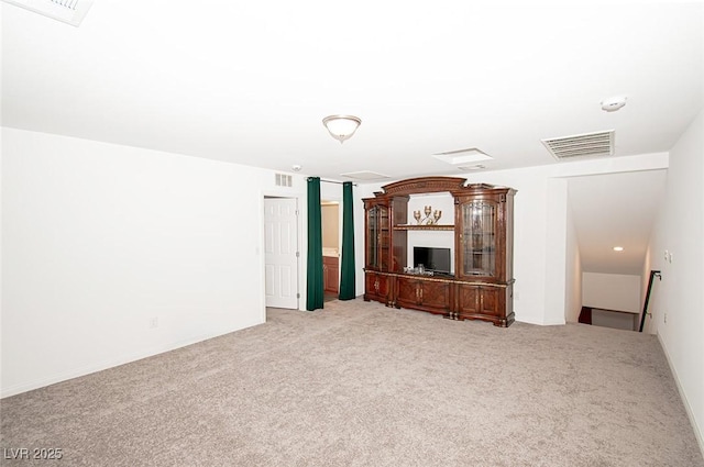 unfurnished living room with light carpet and visible vents