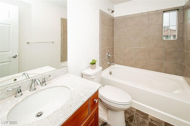 bathroom with vanity, toilet, and shower / bathtub combination