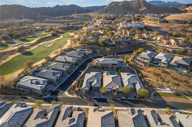 drone / aerial view featuring a residential view and a mountain view