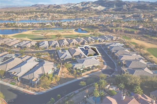 birds eye view of property featuring a residential view and a water and mountain view