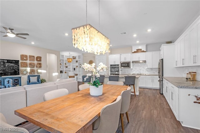 dining room featuring recessed lighting, visible vents, dark wood finished floors, and ceiling fan