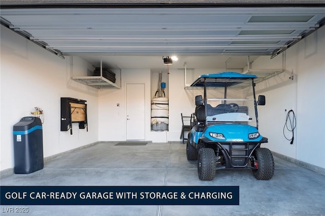 garage with a garage door opener and baseboards