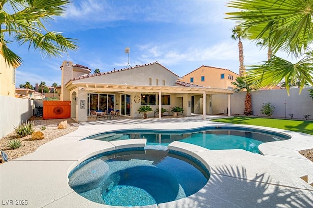 view of swimming pool featuring a pool with connected hot tub, a patio area, a fenced backyard, and a pergola