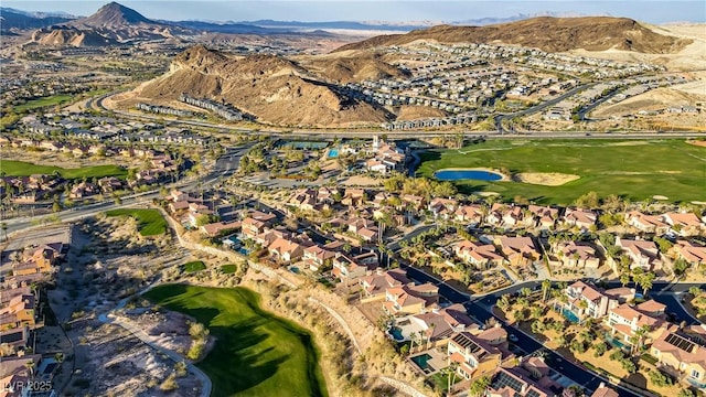 aerial view featuring a residential view, view of golf course, and a water and mountain view